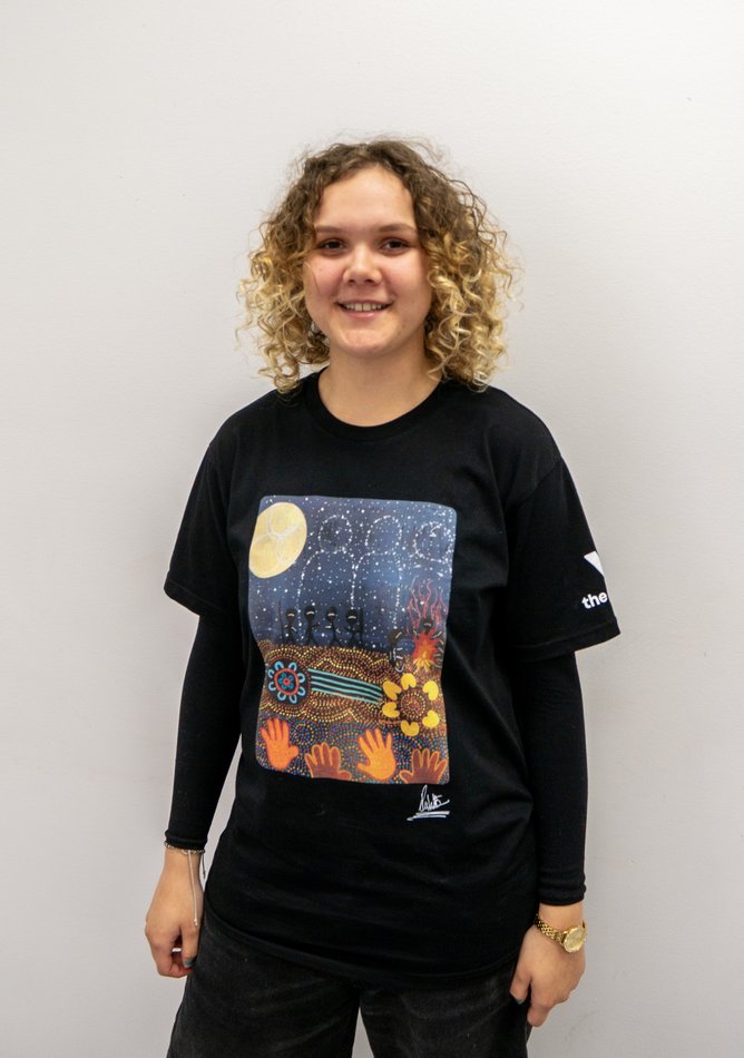Mirrabooka Y School student Paige wearing her winning design.