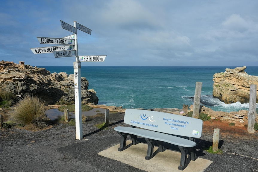 A public bench on the coast says "Cape Northumberland, South Australia's southernmost point"