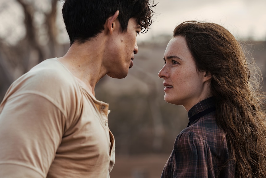 A man and a woman talk to each other