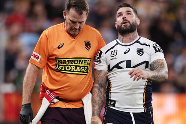 Adam Reynolds of the Broncos is assisted from the field after sustaining an injury.