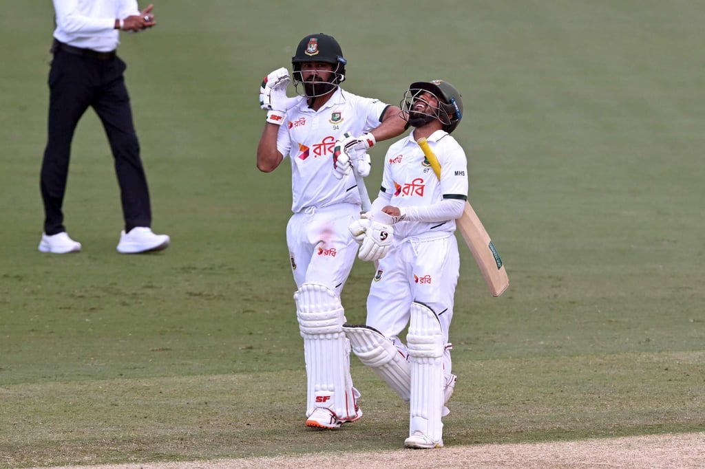 Bangladesh batsmen Shadman Islam (left) and Mominul Haque celebrate after hitting their team’s winning runs. Photo: AFP