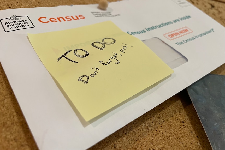 A 2026 census letter with a note saying "to-do, don't forget pet!" stuck to the front