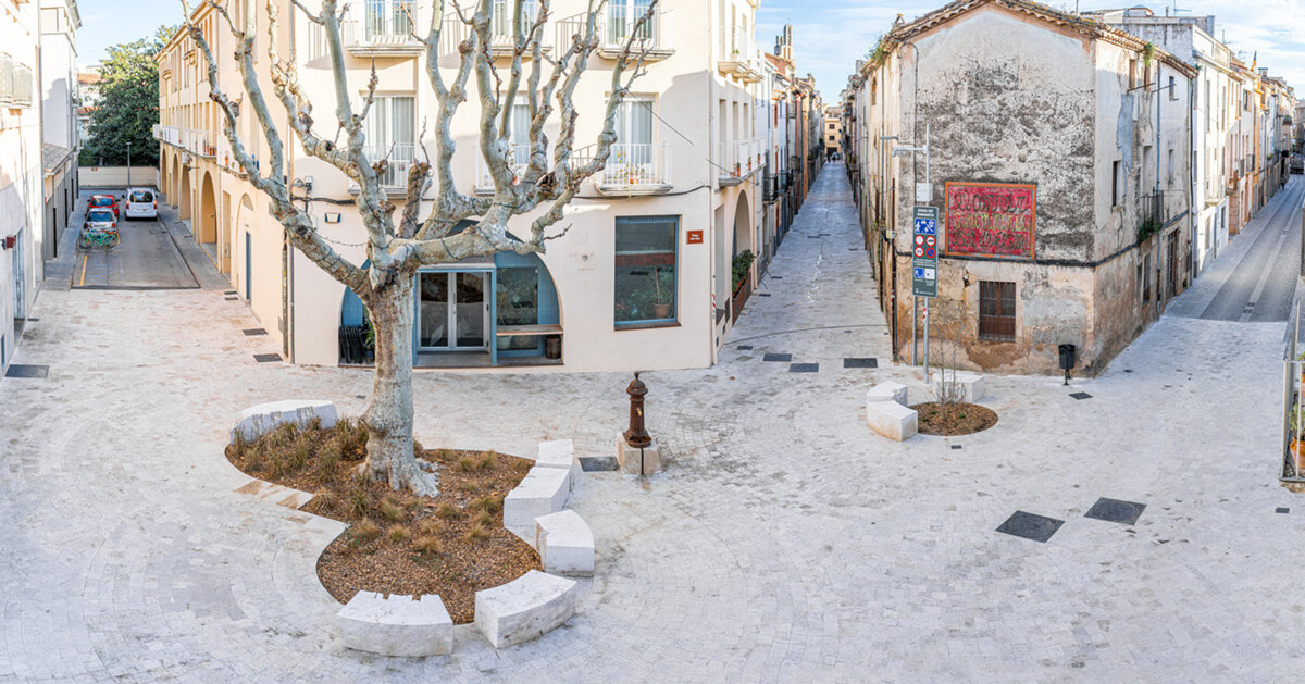 carved travertine transforms paving and planting across spanish town