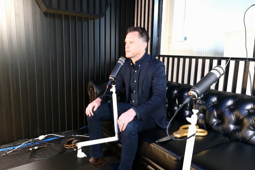 Premier Chris Minns sitting in a radio studio