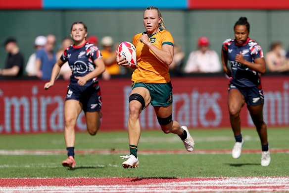 Maddi Levi runs away to score yet another try.