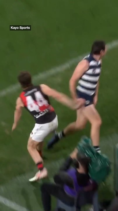 AFL cameraman wiped out in shock moment