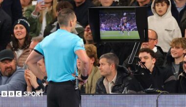 Referee Jarred Gillett reviews the VAR monitor during the Premier League match between Tottenham Hotspur and Leeds United