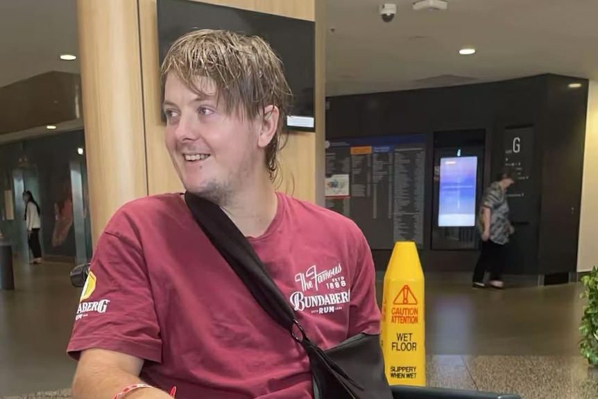 Young man in wheelchair after knee surgery