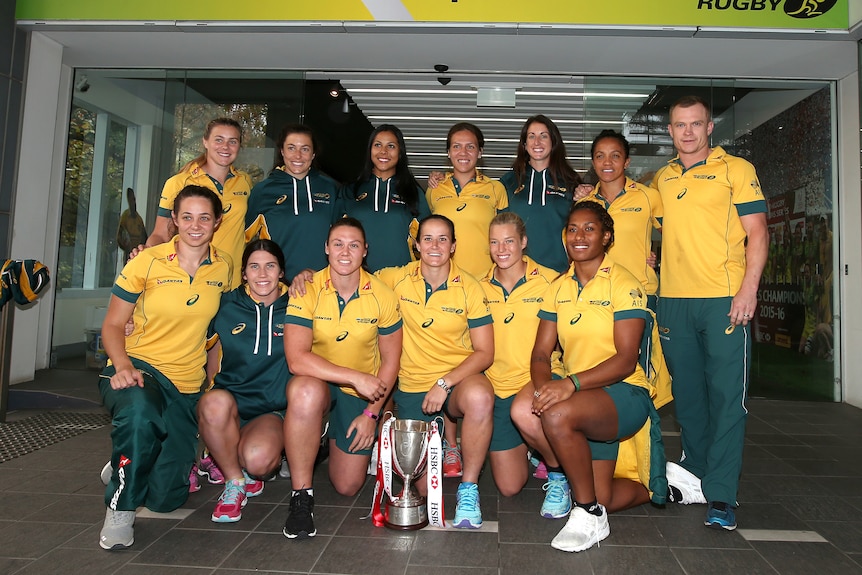 Australia's women's rugby sevens squad poses with 2015/16 World Series trophy.