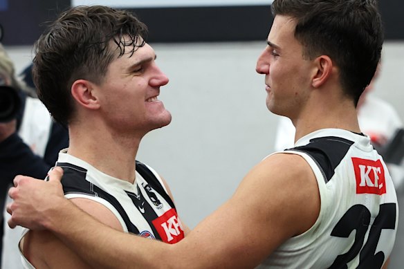 Schultz (left) is a key cog in the Magpie machine under Craig McRae and alongside superstar onballer Nick Daicos (right).