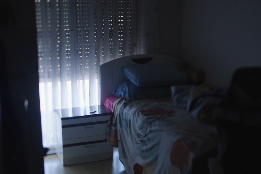 Empty bed in bedroom
