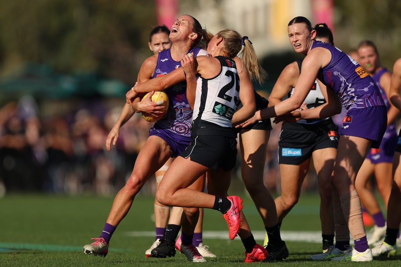Gabrielle Newton of the Dockers is tackled by Keeley Sherar.