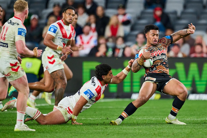 A man is tackled during a rugby league match