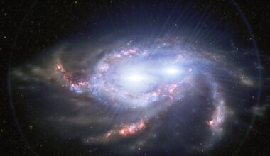 Three black holes appear to be feeding inside a single galaxy seen 1.2 billion years after the Big Bang, and the two nearest its centre are close enough to spiral together within roughly 700 million years — though the paper reporting them calls it evidence, not a confirmed triplet
