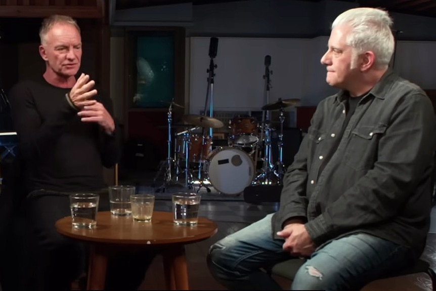 singer and songwriter sting sits behind a microphone during an interview with us music guru rick beato