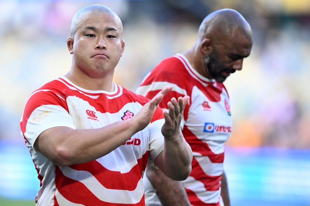 Shuhei Takeuchi of Japan applauds the fans after losing to Australia in a rugby Test match. Photo: EPA