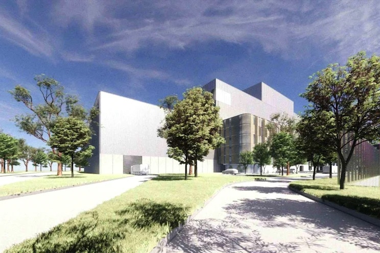 An illustration of a large grey building without windows with trees and grass around it.