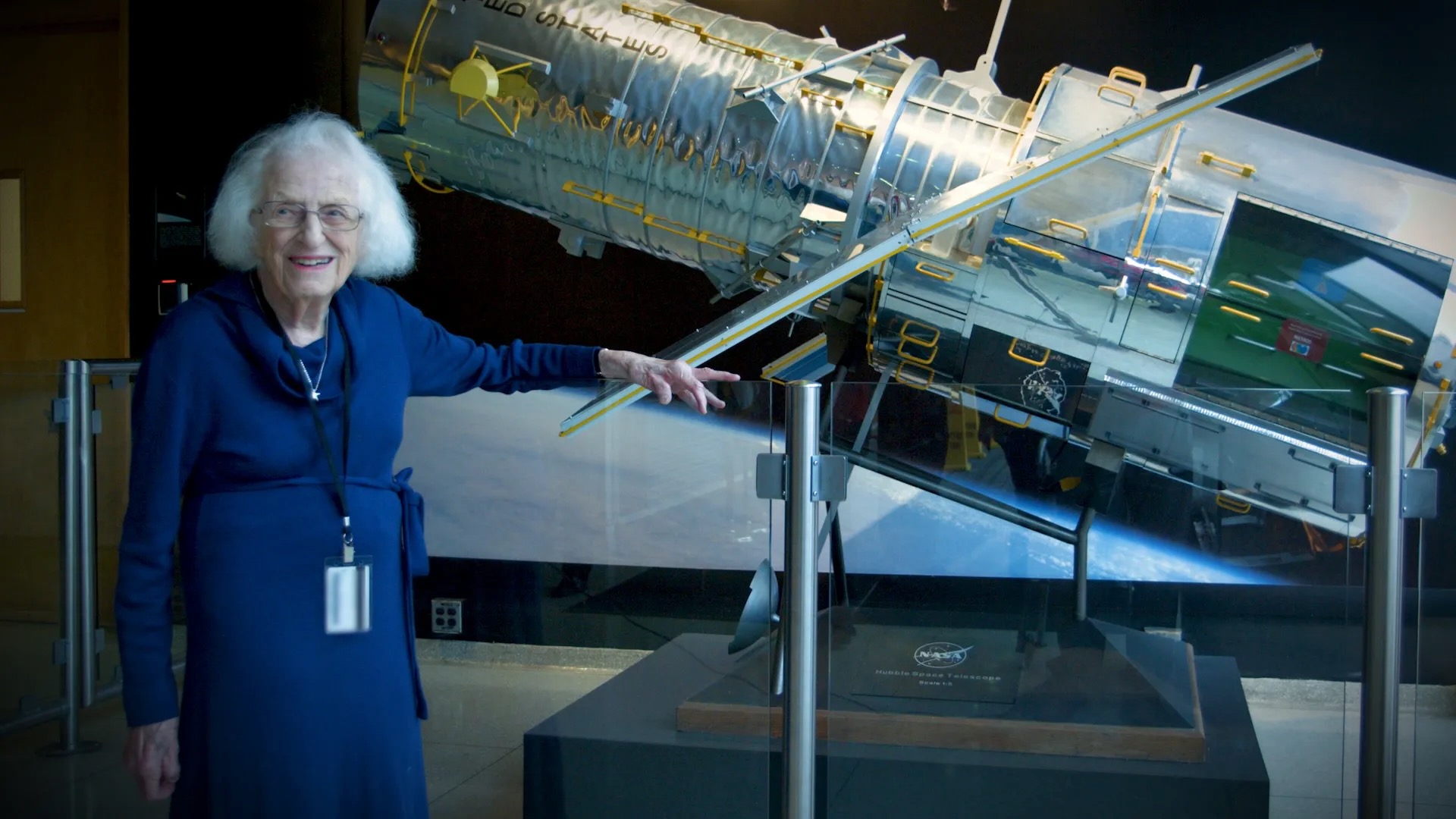 Nancy Grace Roman stands next to a scale model of the Hubble Space Telescope outside the Hubble control center at NASA’s Goddard Space Flight Center in Maryland. Roman is known as the “Mother of Hubble.”
