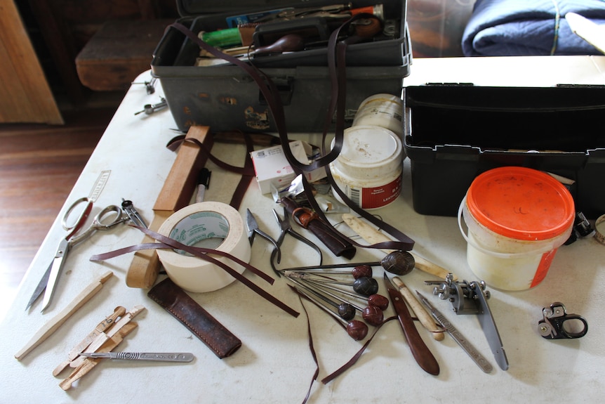 A table covered with crafting tools
