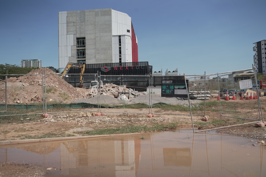 Workers build a second data centre beside an existing facility.