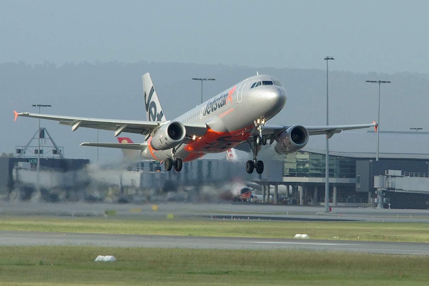 A Jetstar aircraft taking off.
