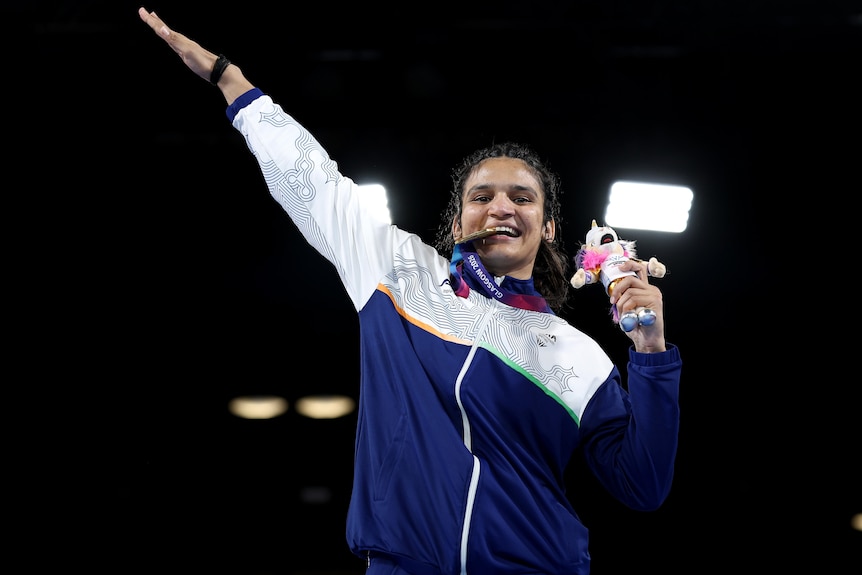 Arundhati Choudhary celebrates winning gold for India in boxing at Commonwealth Games.