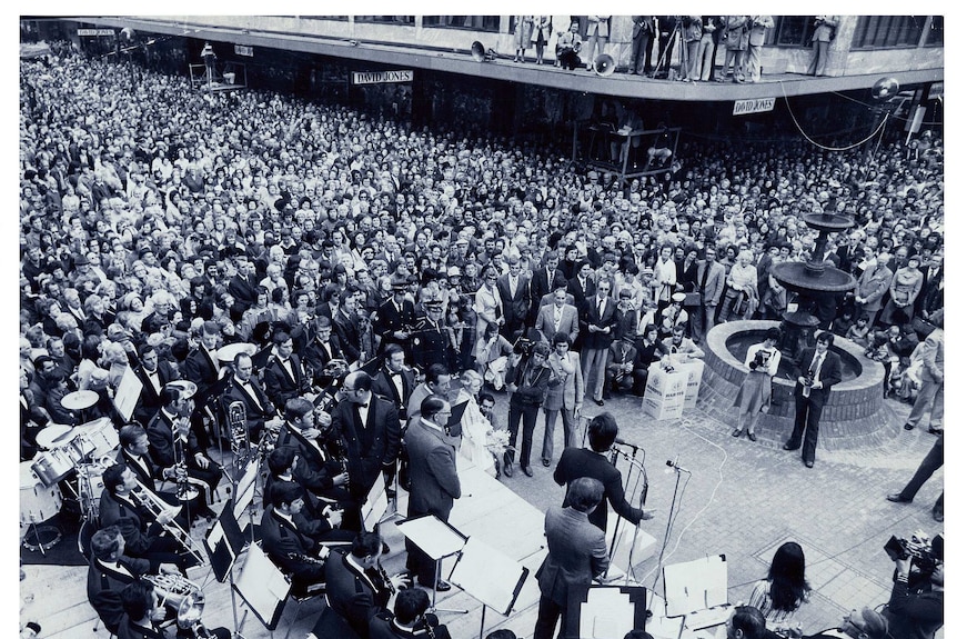 Performers and the public gather for the opening of Adelaide's Rundle Mall.