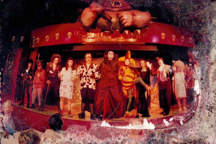 A stage full of people in exotic and humorous make-up