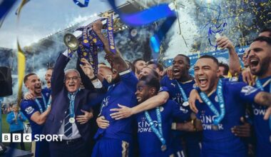 Claudio Ranieri with the Premier League trophy and a crown being put on his head
