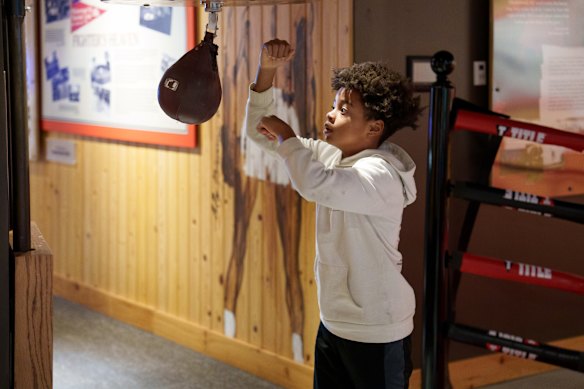 A museum visitor tests their skills. 