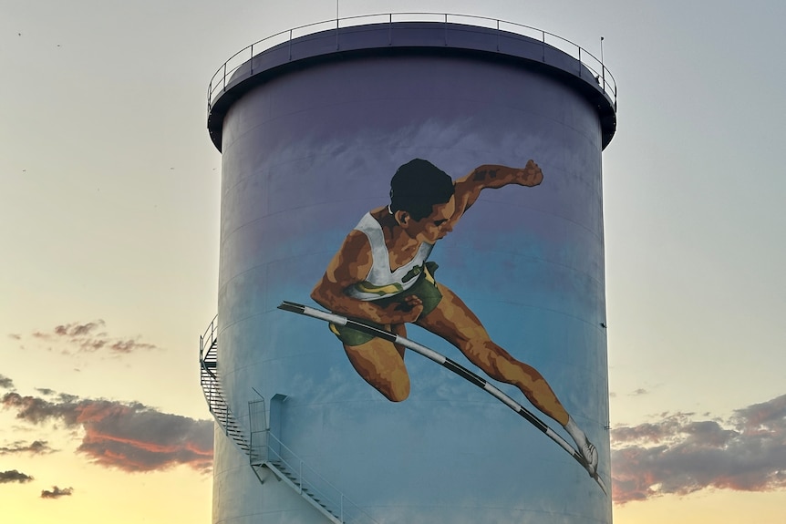 The painting of an athlete on a large water tower