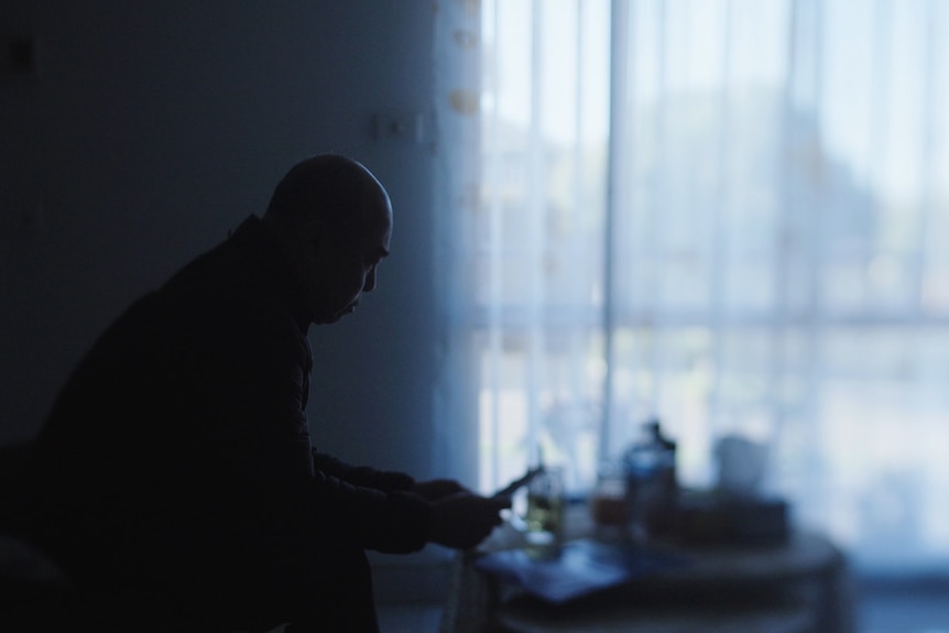 Man looking at photos of woman