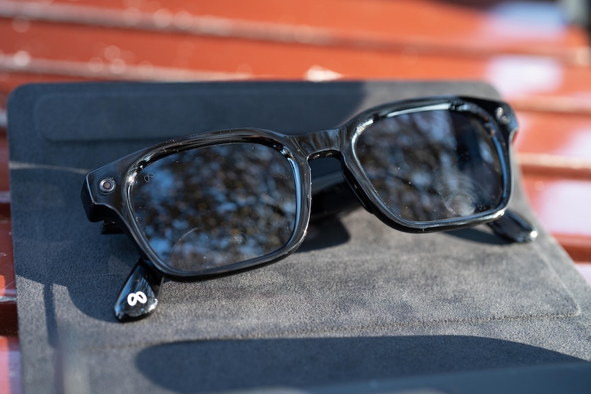 A pair of smart glasses on a bench.