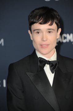 A young actor dressed in a tux.