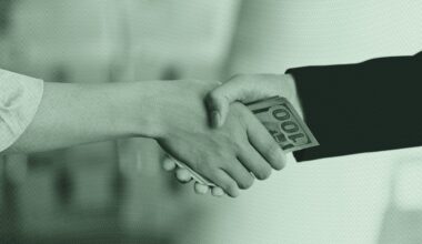 Hands exchanging money.