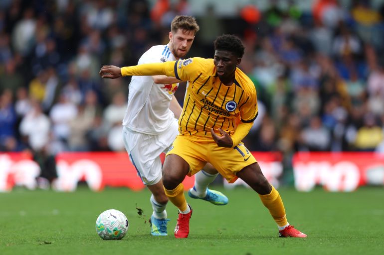 LEEDS, ENGLAND - MAY 17: Carlos Baleba of Brighton & Hove Albion is put under pressure by Anton Stach of Leeds United during the Premier League match between Leeds United and Brighton & Hove Albion at Elland Road on May 17, 2026 in Leeds, England. (Photo by Nathan Stirk/Getty Images)