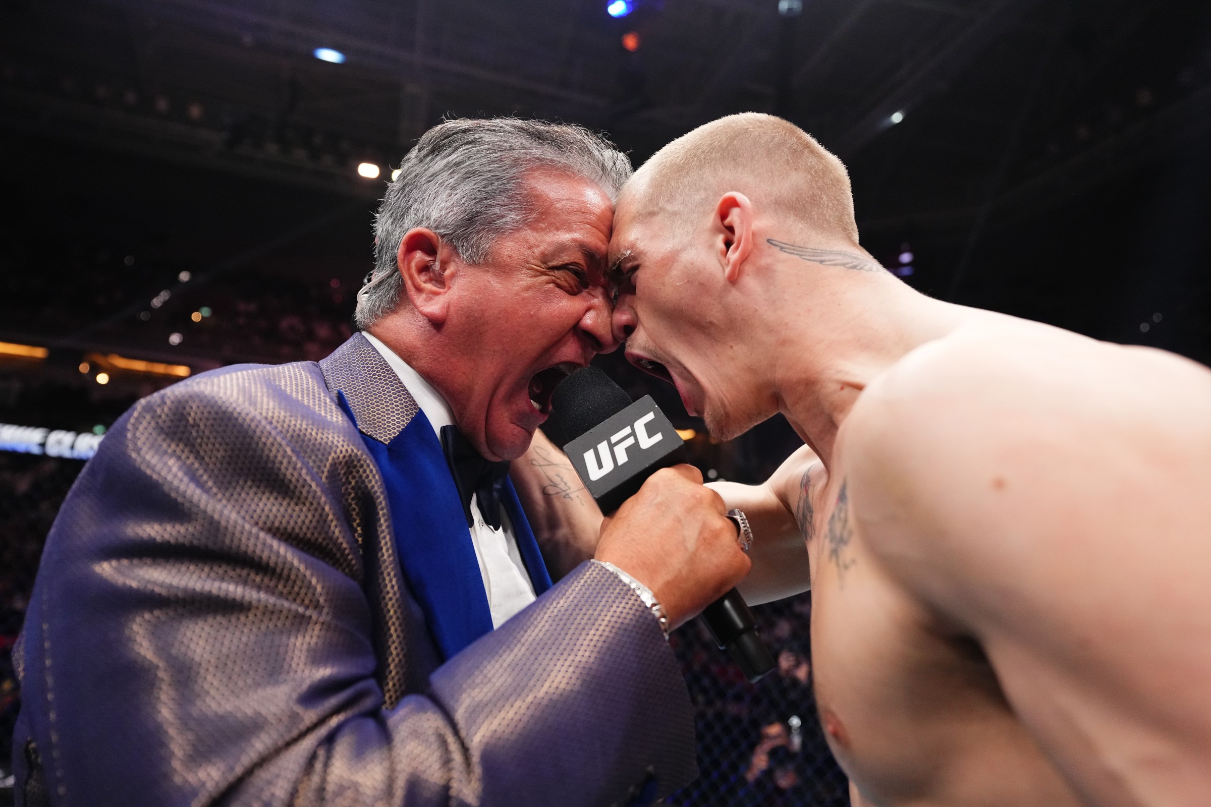 DOHA, QATAR - NOVEMBER 22: (L-R) Bruce Buffer introduces Ian Machado Garry of Ireland prior to his fight during the UFC Fight Night event at ABHA Arena on November 22, 2025 in Doha, Qatar. (Photo by Jeff Bottari/Zuffa LLC)