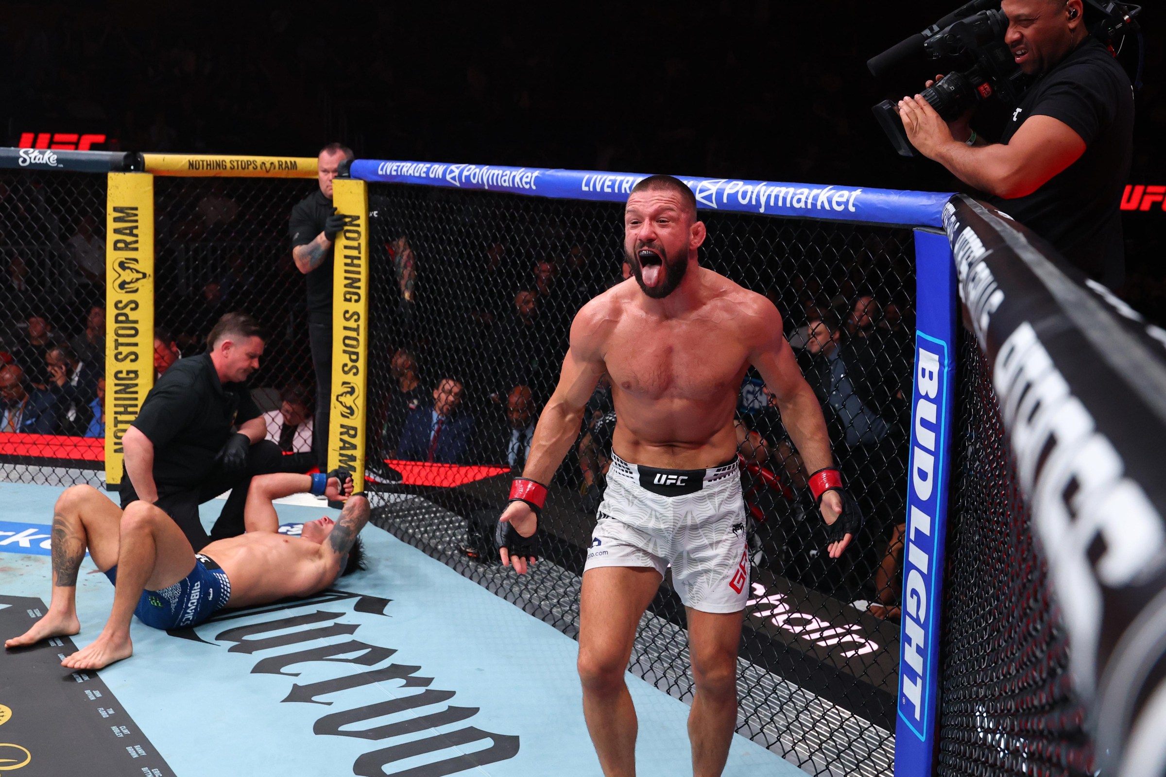 MIAMI, FLORIDA - APRIL 11: Mateusz Gamrot of Poland reacts after a submission victory against Esteban Ribovics of Argentina in a lightweight fight during the UFC 327 event at Kaseya Center on April 11, 2026 in Miami, Florida. (Photo by Ed Mulholland/Zuffa LLC)