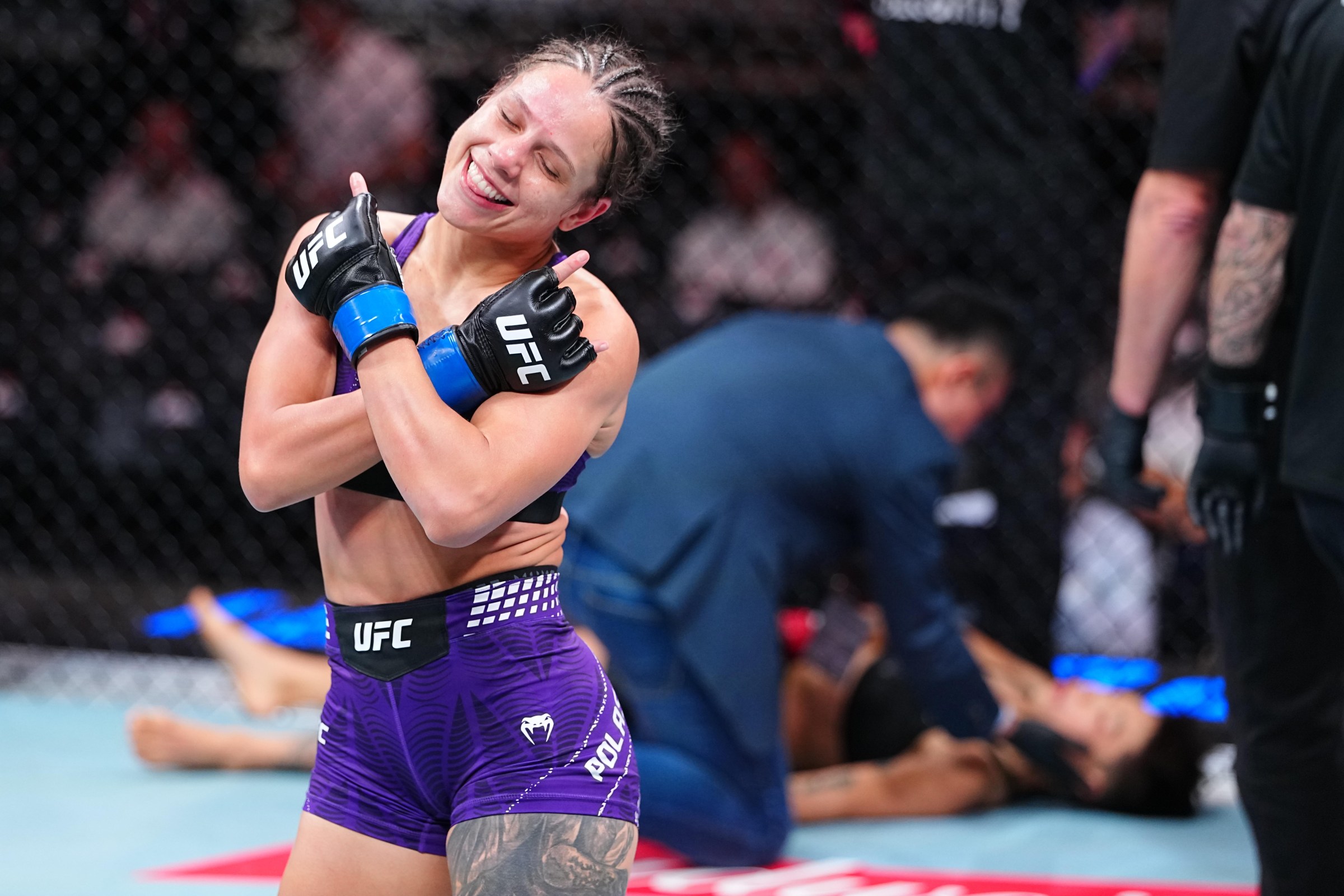 SHANGHAI, CHINA - AUGUST 29: Julia Polastri of Brazil reacts after knocking out Xiong Jingnan of China in a strawweight fight during the UFC Fight Night event at SPD Bank Oriental Sports Center on August 29, 2026 in Shanghai, China.