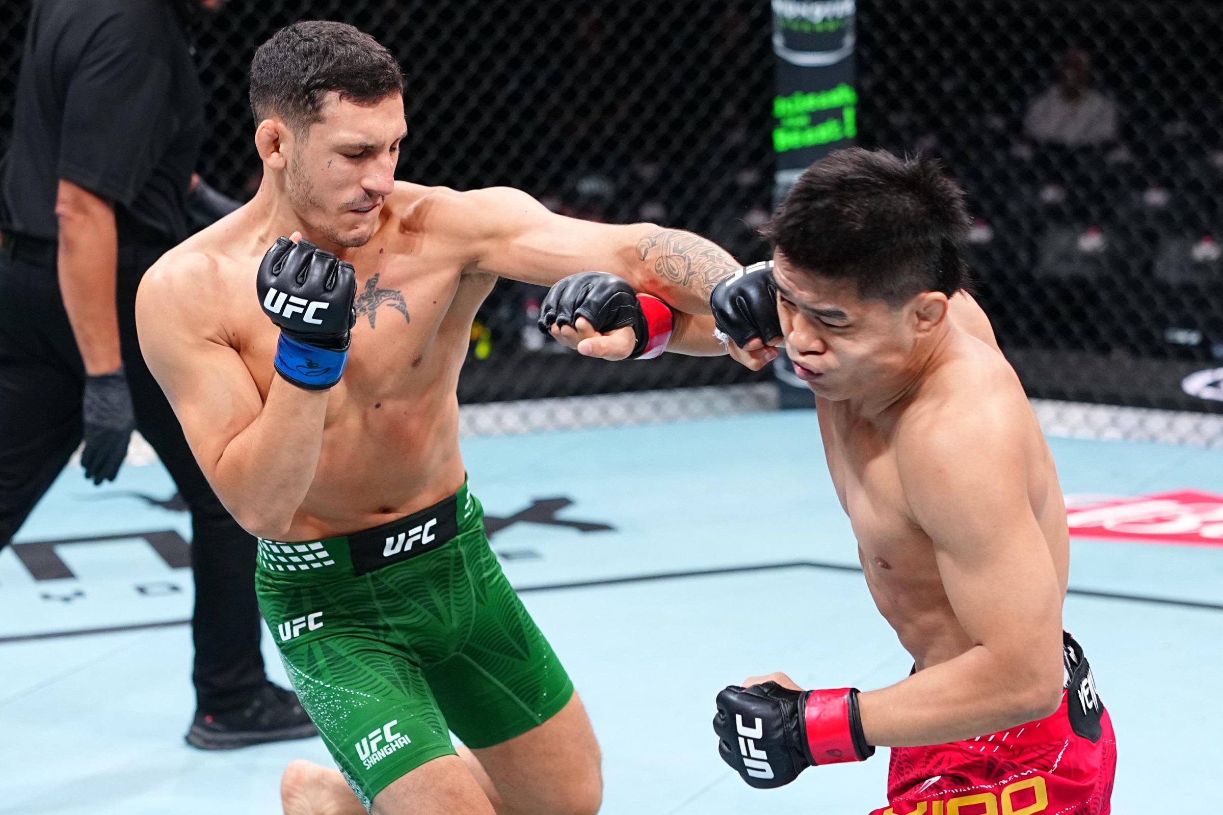 SHANGHAI, CHINA - AUGUST 29: Francesco Nuzzi of Italy punches Xiao Long of China in a bantamweight fight during the UFC Fight Night event at SPD Bank Oriental Sports Center on August 29, 2026 in Shanghai, China. (Photo by Chris Unger/Zuffa LLC)