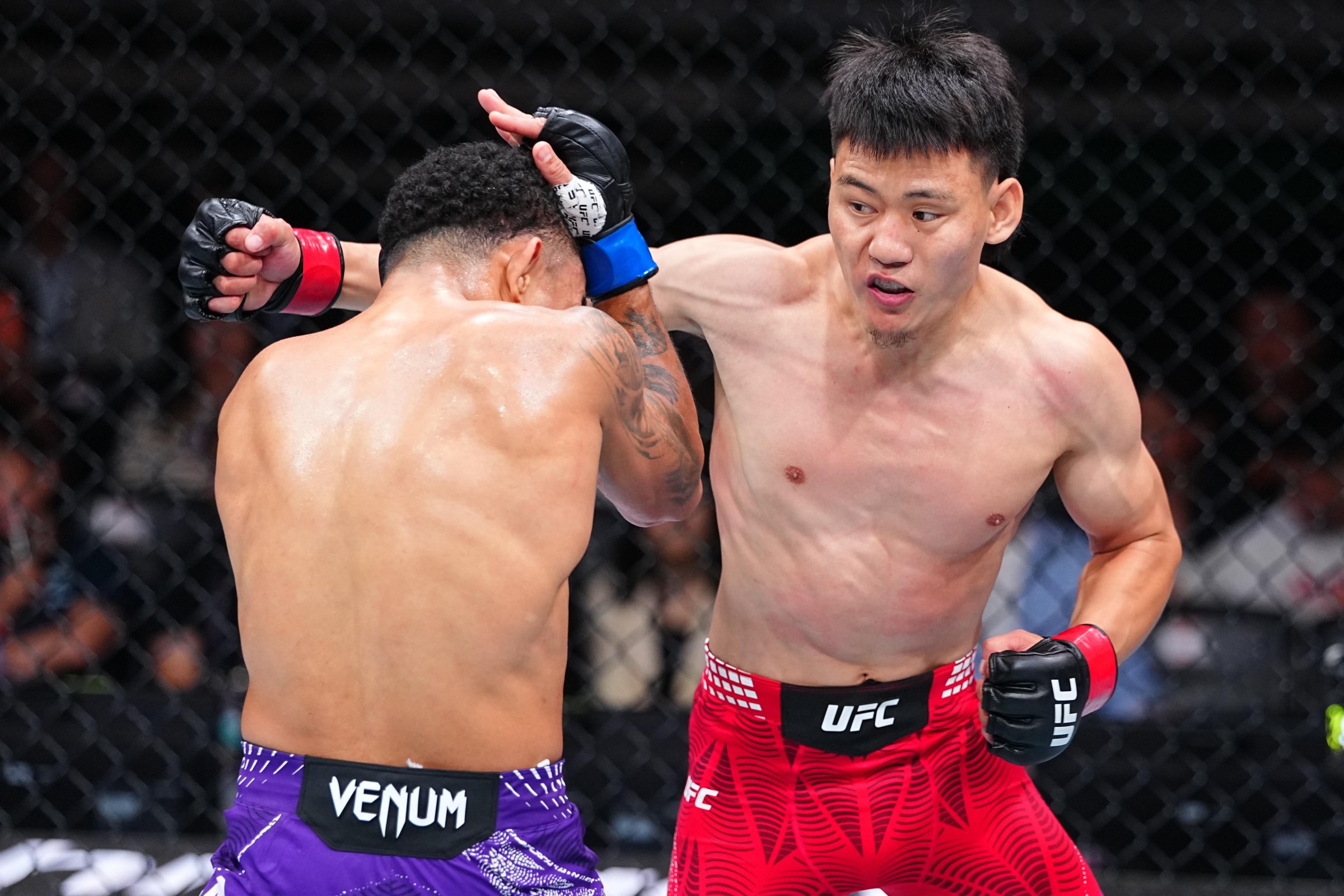 SHANGHAI, CHINA - AUGUST 29: (R-L) Namsrai Batbayar of Mongolia punches Andre Lima of Brazil in a flyweight fight during the UFC Fight Night event at SPD Bank Oriental Sports Center on August 29, 2026 in Shanghai, China. (Photo by Chris Unger/Zuffa LLC)