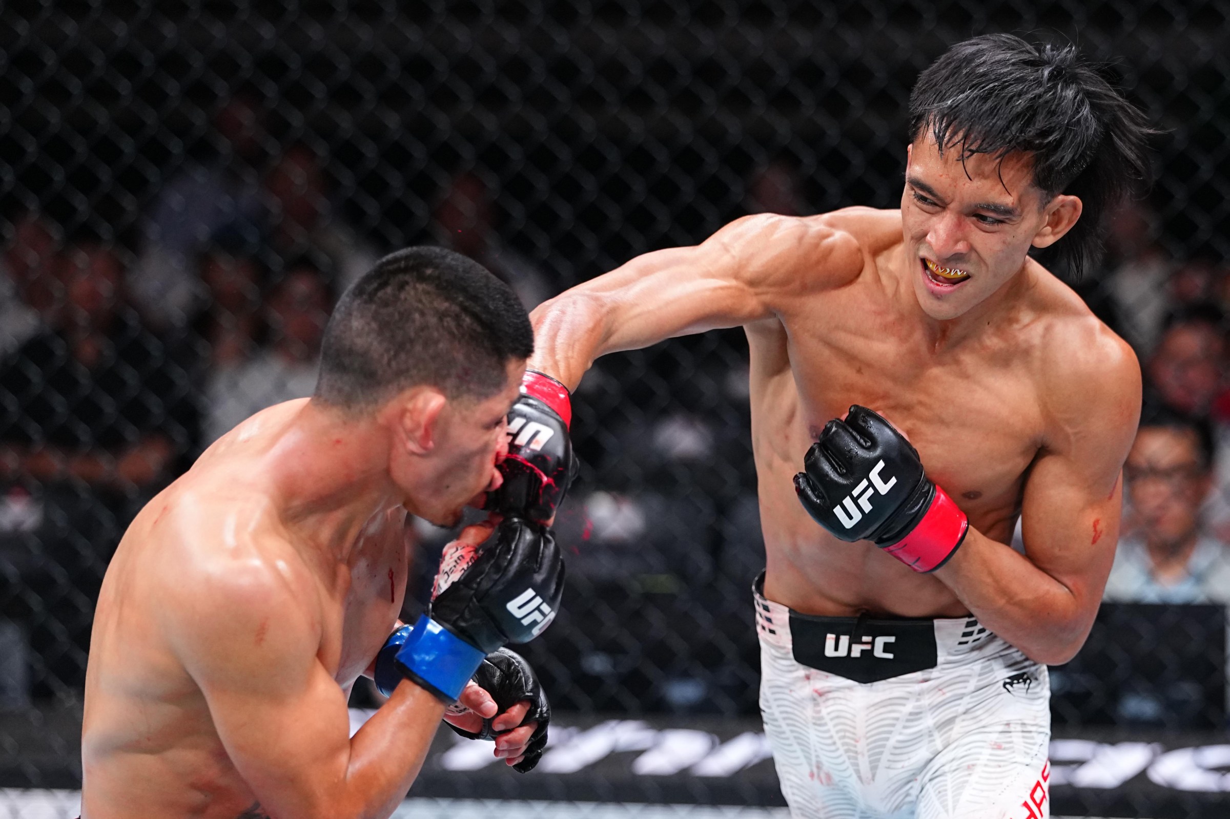 SHANGHAI, CHINA - AUGUST 29: Bilal Hasan knocks out Nilson Rojas of Peru in a flyweight fight during the UFC Fight Night event at SPD Bank Oriental Sports Center on August 29, 2026 in Shanghai, China. (Photo by Chris Unger/Zuffa LLC)