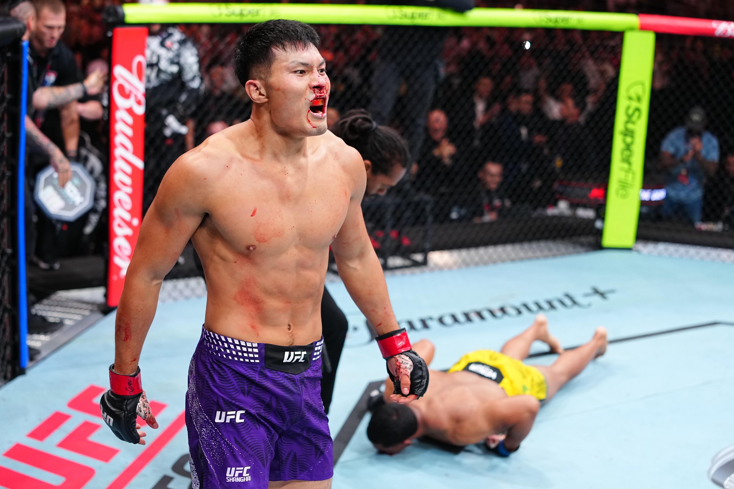 SHANGHAI, CHINA - AUGUST 29: Liu Ce of China reacts after knocking out Levi Rodrigues Jr. of Brazil in a light heavyweight fight during the UFC Fight Night event at SPD Bank Oriental Sports Center on August 29, 2026 in Shanghai, China. (Photo by Chris Unger/Zuffa LLC)