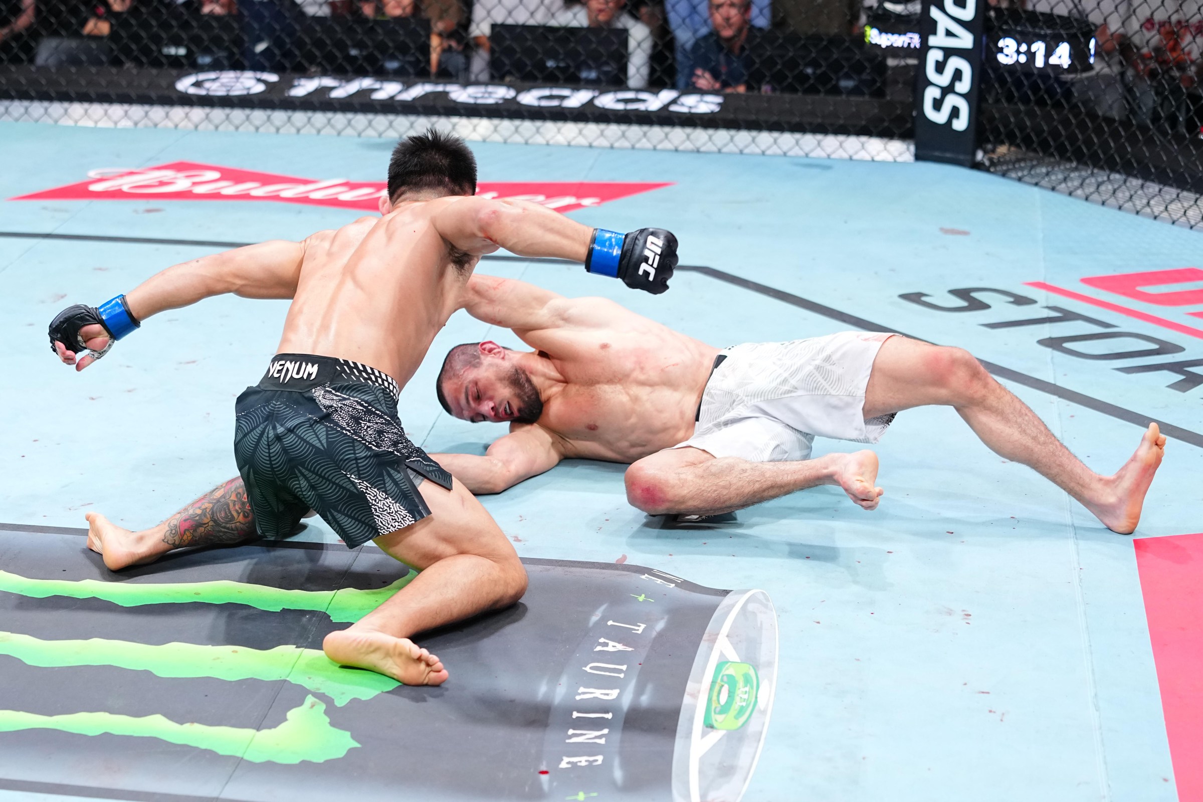 SHANGHAI, CHINA - AUGUST 29: (L-R) Song Yadong of China punches Umar Nurmagomedov of Russia in a bantamweight fight during the UFC Fight Night event at SPD Bank Oriental Sports Center on August 29, 2026 in Shanghai, China. (Photo by Chris Unger/Zuffa LLC)