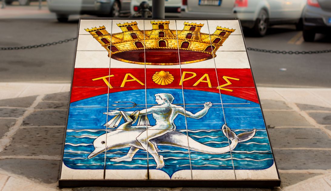 Taranto's coat of arms celebrates the legend of how the city's founder, Taras, was rescued by a dolphin.