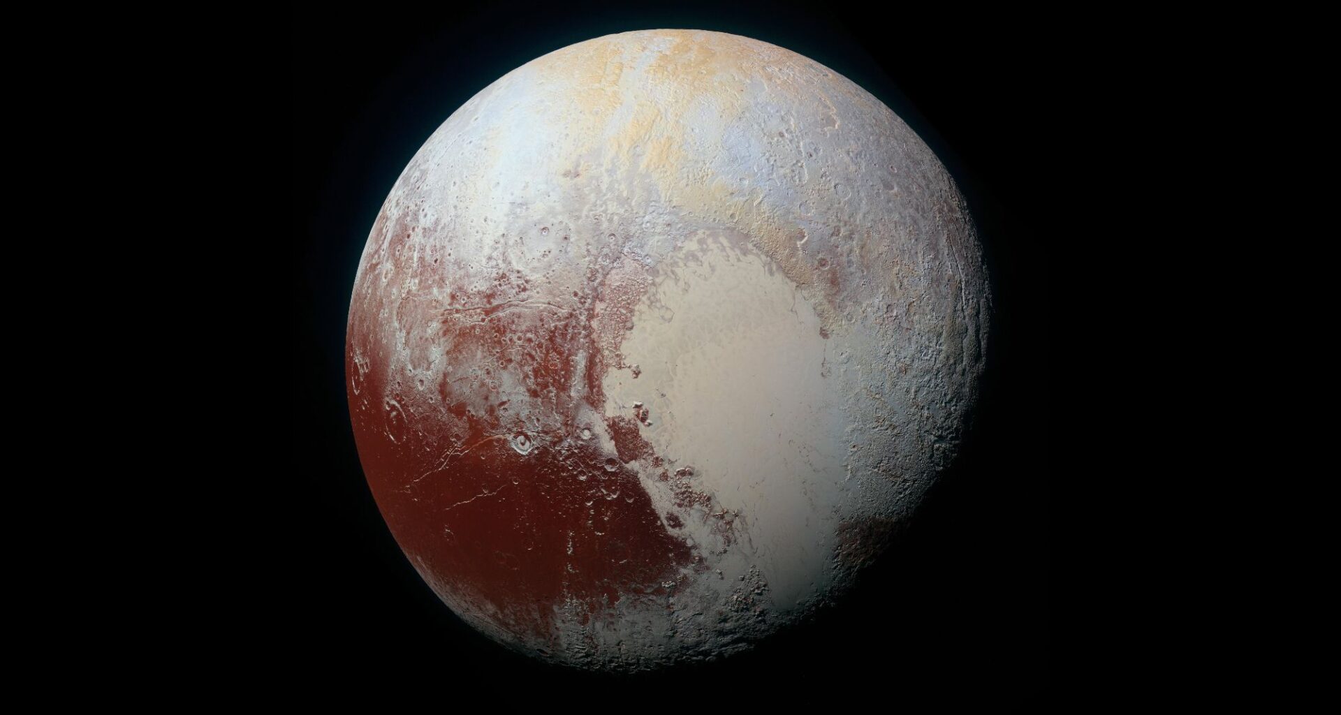 A view of a world with tan shades and a reddish area toward the bottom left of it.