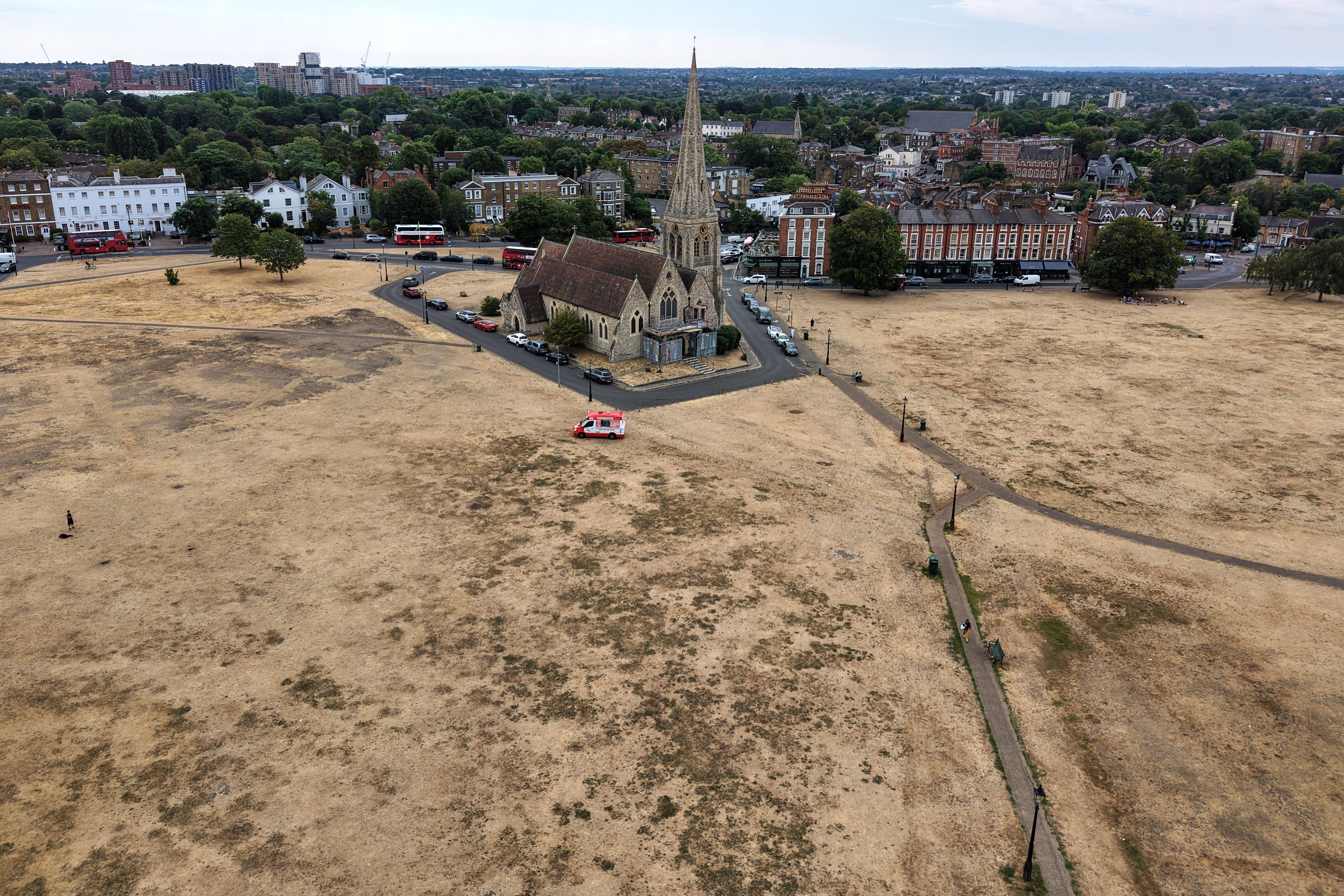 Dried vegetation is seen surrounding the All Saints church in Blackheath, south London