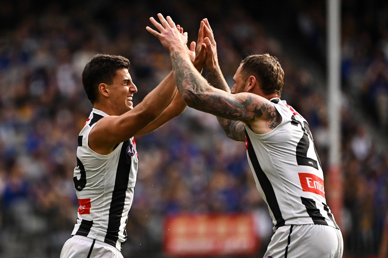 Nick Daicos (left) picked up 21 disposals in the first half and kicked a brilliant running goal.