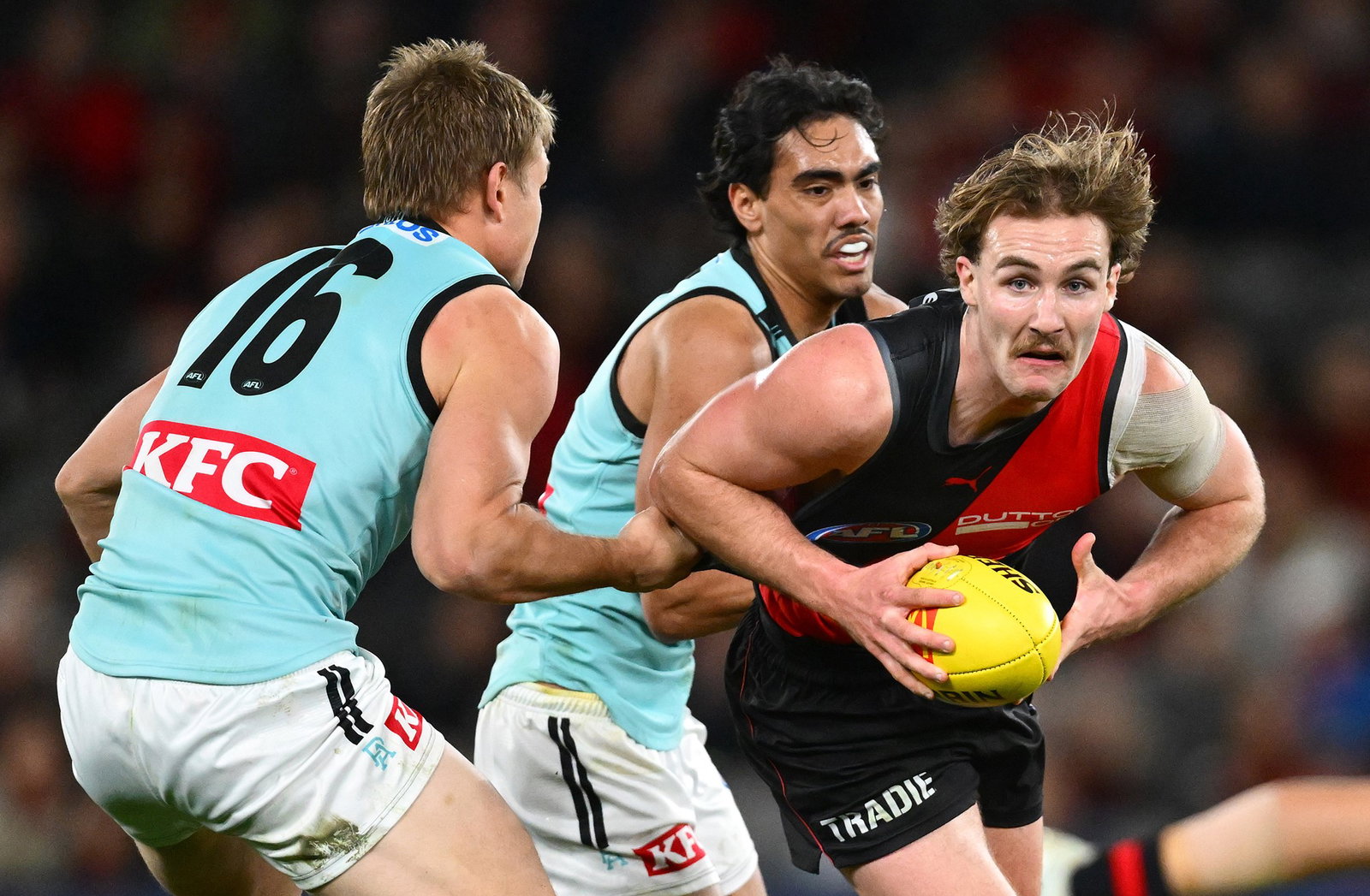 Essendon and Port Adelaide's clash is going down to the wire at Docklands.
