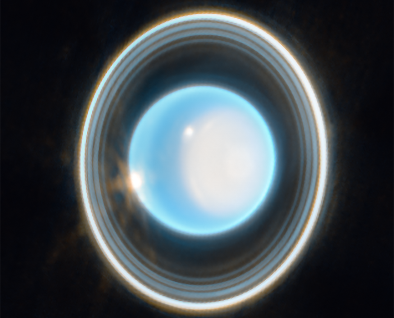 Uranus rotates almost completely on its side, tipped by 97.77 degrees, most likely by a giant impact billions of years ago — but its tilted moons keep the case from being closed